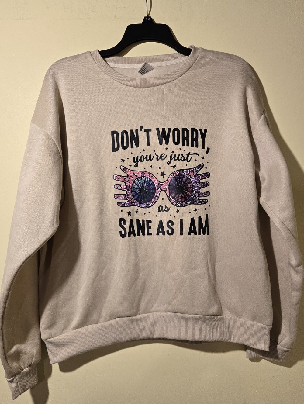 Graphic "Dont Worry. You're Just As Sane As I Am" Crewneck Sweatshirt in Beige.